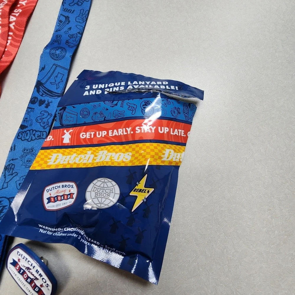 Set Of 2 Dutch Bros Pin and Lanyards 6/25/26 Red/Blue Lightning Bolt Always Stok